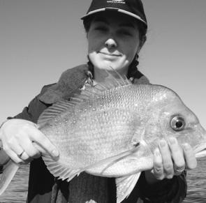 Clare Rashbrook with a snapper taken from the shallow ground at East Reef on a floating pilchard.